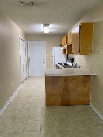 a bathroom with a sink a mirror and a vanity