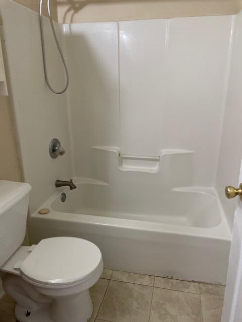 6905 Sea Turtle Circle, Unit E Navarre, FL 32566 - Photo 10 of 13 a bathroom with a toilet and a bath tub