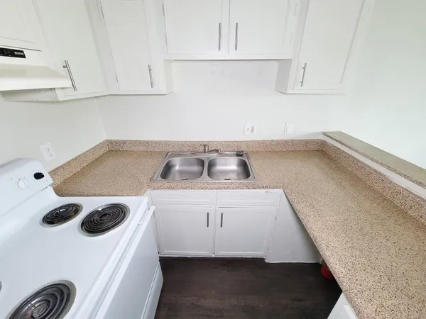 a view of kitchen cabinets and a appliances