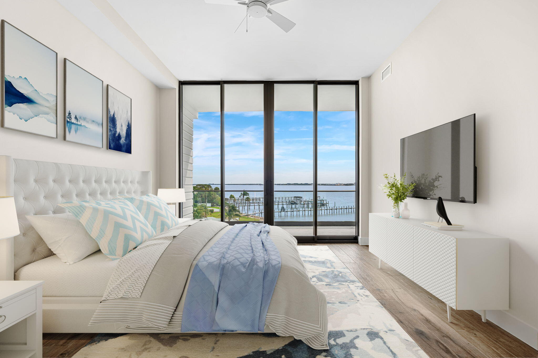 225 Strand Drive, Unit 404 Melbourne Beach, FL 32951 - Photo 12 of 30 a spacious bedroom with a large bed and a flat tv screen on dresser