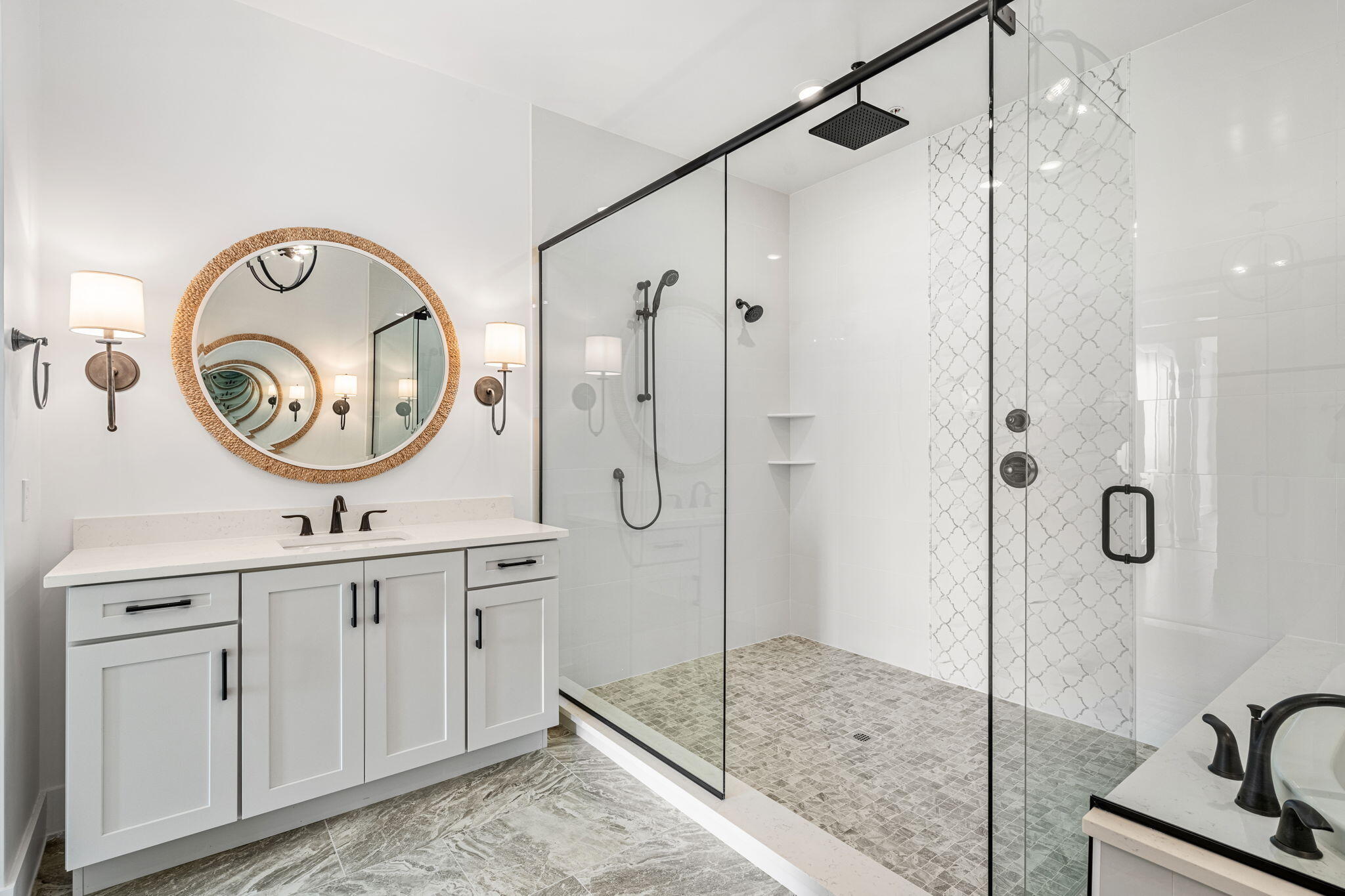 225 Strand Drive, Unit 404 Melbourne Beach, FL 32951 - Photo 13 of 30 a bathroom with a sink a mirror a vanity and a shower