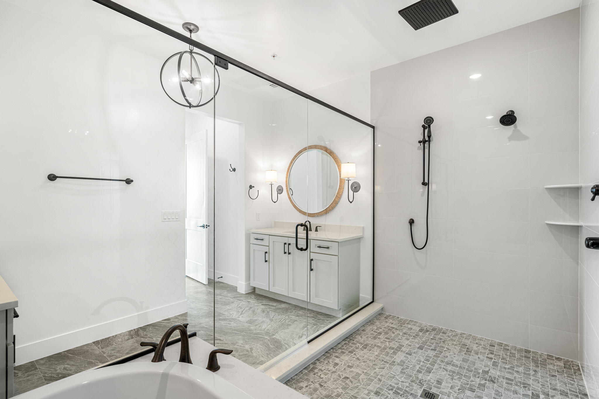 225 Strand Drive, Unit 404 Melbourne Beach, FL 32951 - Photo 15 of 30 a bathroom with a sink a mirror and a shower