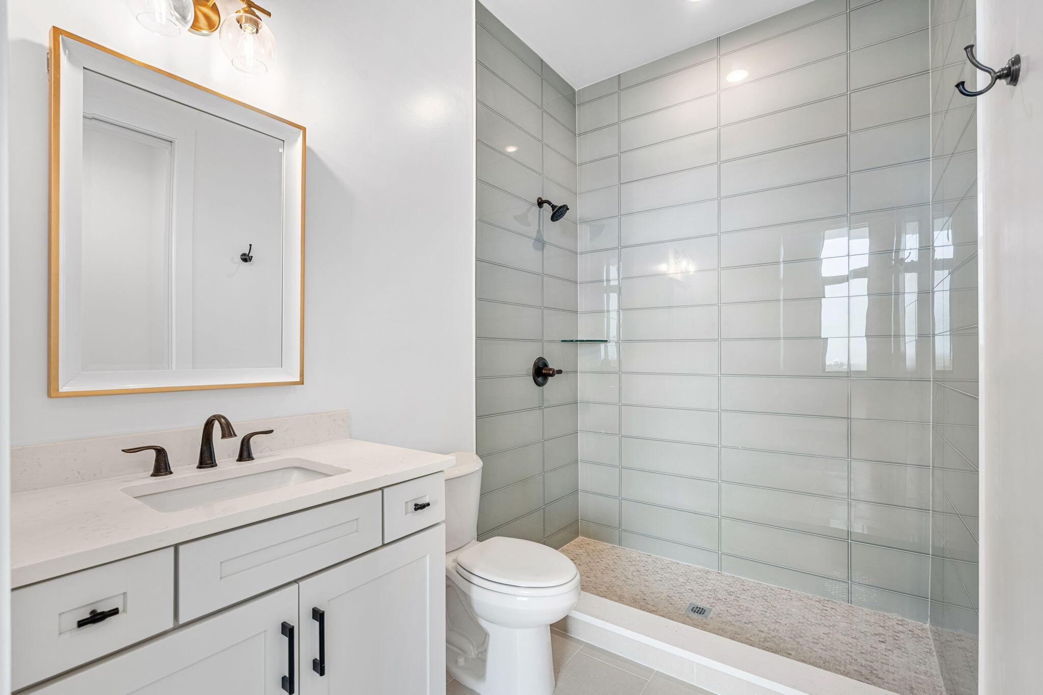 225 Strand Drive, Unit 404 Melbourne Beach, FL 32951 - Photo 18 of 30 a bathroom with a sink toilet and shower