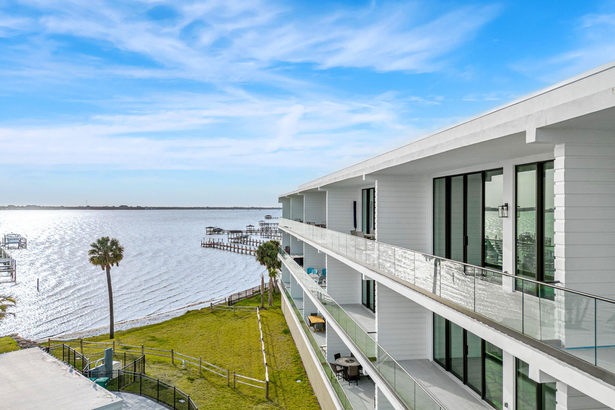 225 Strand Drive, Unit 404 Melbourne Beach, FL 32951 - Photo 21 of 30 a view of a balcony with chairs
