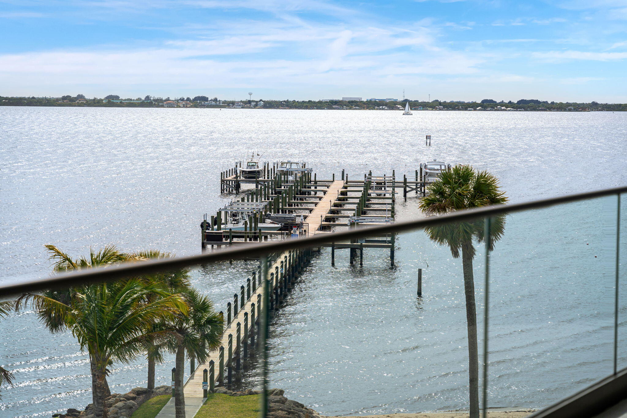 225 Strand Drive, Unit 404 Melbourne Beach, FL 32951 - Photo 4 of 30 a view of a lake from a balcony