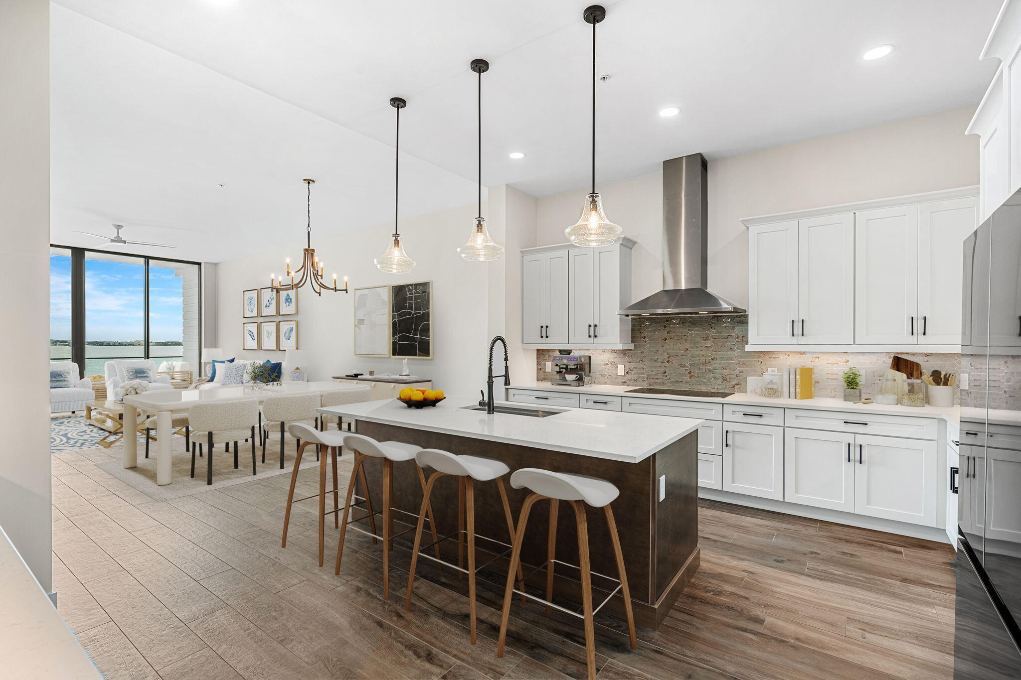 225 Strand Drive, Unit 404 Melbourne Beach, FL 32951 - Photo 6 of 30 a large kitchen with kitchen island a island a stove a sink a dining table and chairs