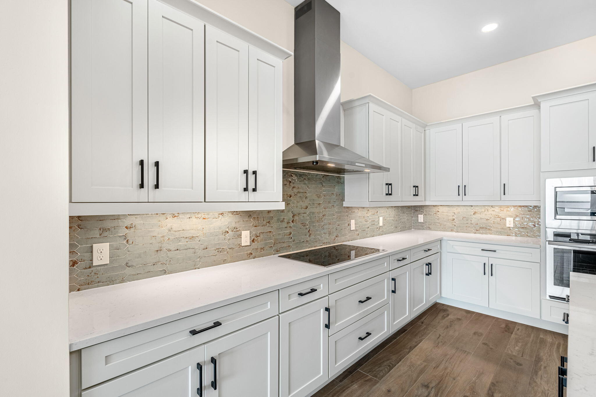 225 Strand Drive, Unit 404 Melbourne Beach, FL 32951 - Photo 7 of 30 a kitchen with granite countertop white cabinets and white appliances