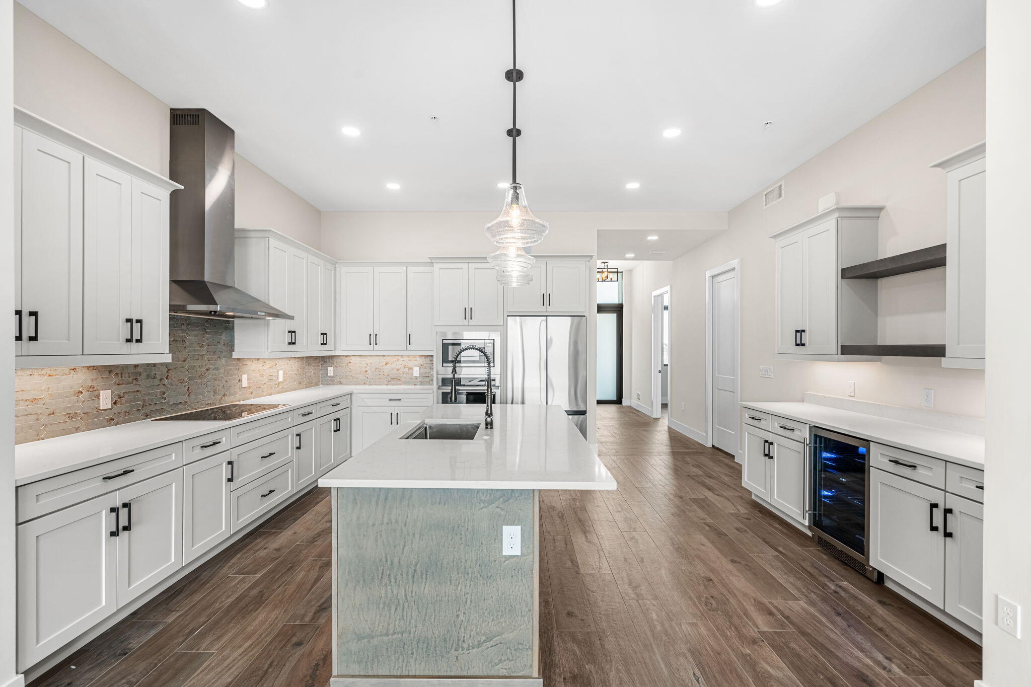 225 Strand Drive, Unit 404 Melbourne Beach, FL 32951 - Photo 8 of 30 a large kitchen with stainless steel appliances lots of counter space sink refrigerator and cabinets