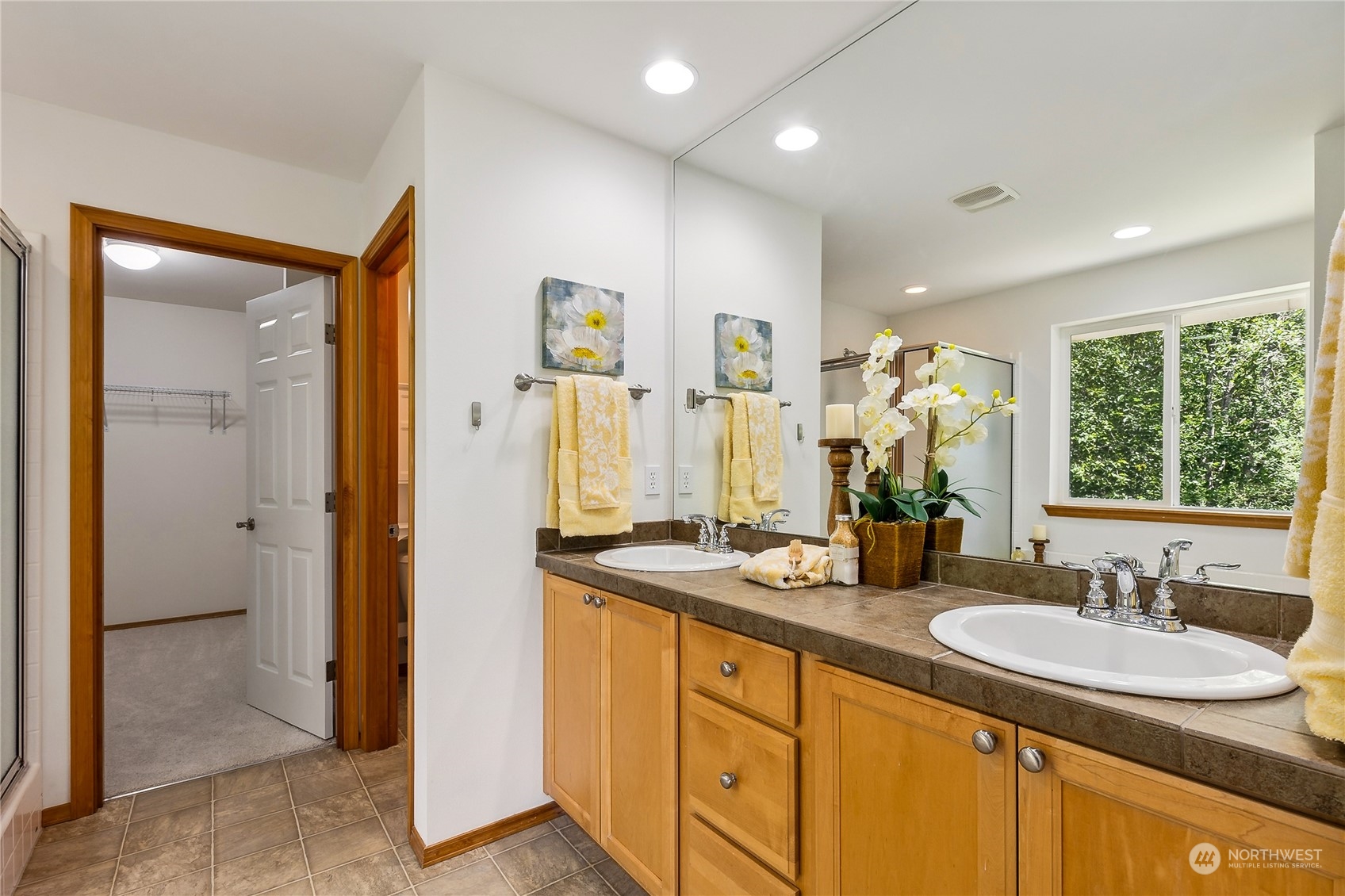 3426 172nd Place Southeast Bothell, WA 98012 - Photo 22 of 33 a bathroom with a sink double vanity and a mirror