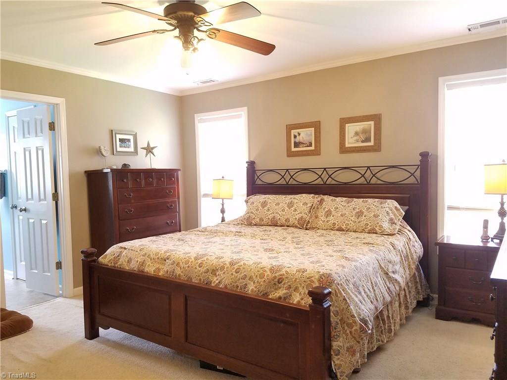 7822 Wilson Farm Road Summerfield, NC 27358 - Photo 19 of 30 His and hers closets, updated bathroom