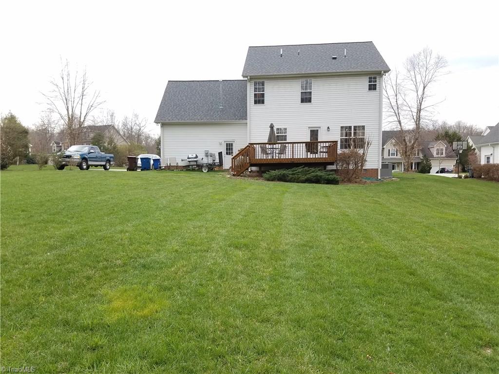7822 Wilson Farm Road Summerfield, NC 27358 - Photo 3 of 30 Level backyard, off site septic.