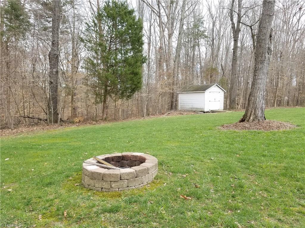 7822 Wilson Farm Road Summerfield, NC 27358 - Photo 4 of 30 Fire pit and storage unit