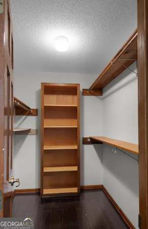 a bathroom with a granite countertop sink a toilet and bathtub