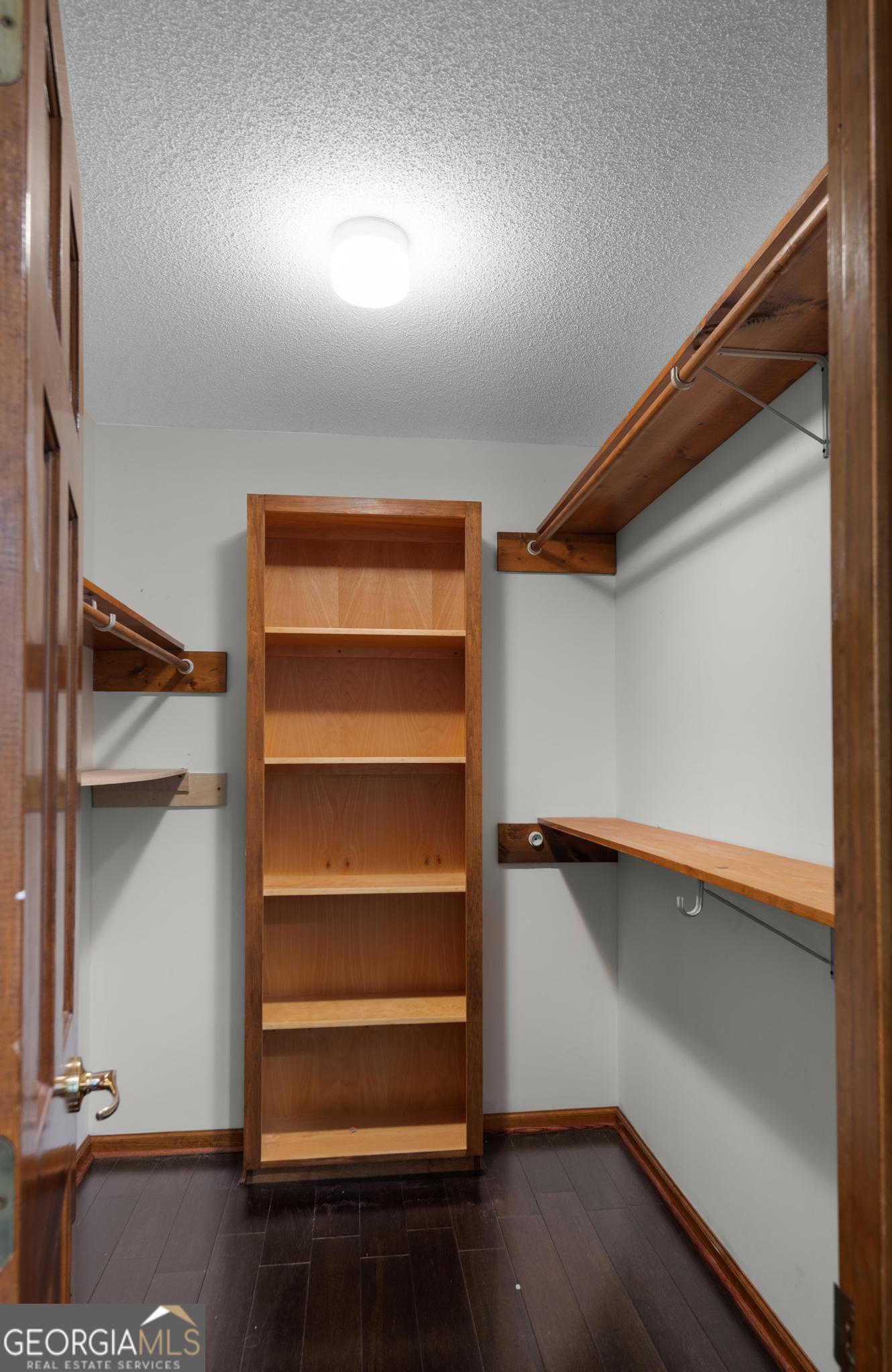 4909 Perry Road Claxton, GA 30417 - Photo 29 of 54 a view of walk in closet with empty racks