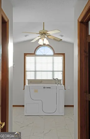 a view of washer and dryer with a kitchen