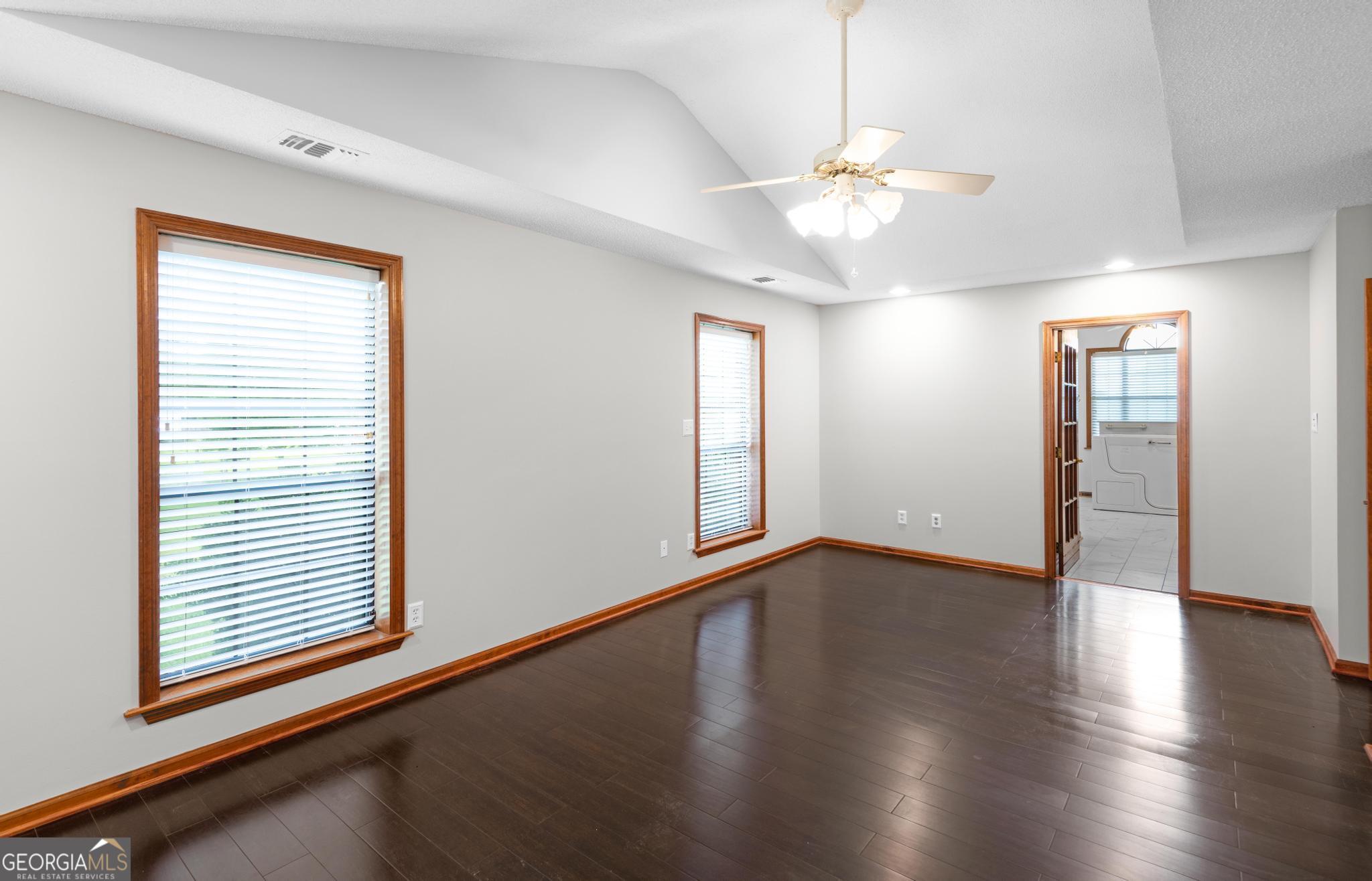 4909 Perry Road Claxton, GA 30417 - Photo 38 of 54 a view of an empty room with wooden floor and a window