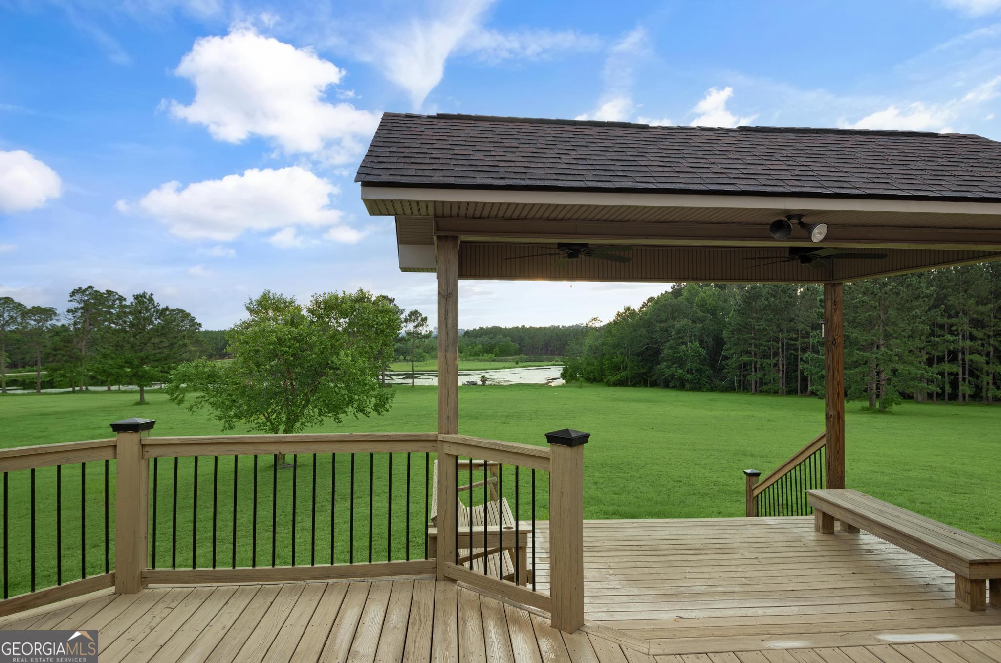 4909 Perry Road Claxton, GA 30417 - Photo 46 of 54 a view of a deck with a big yard