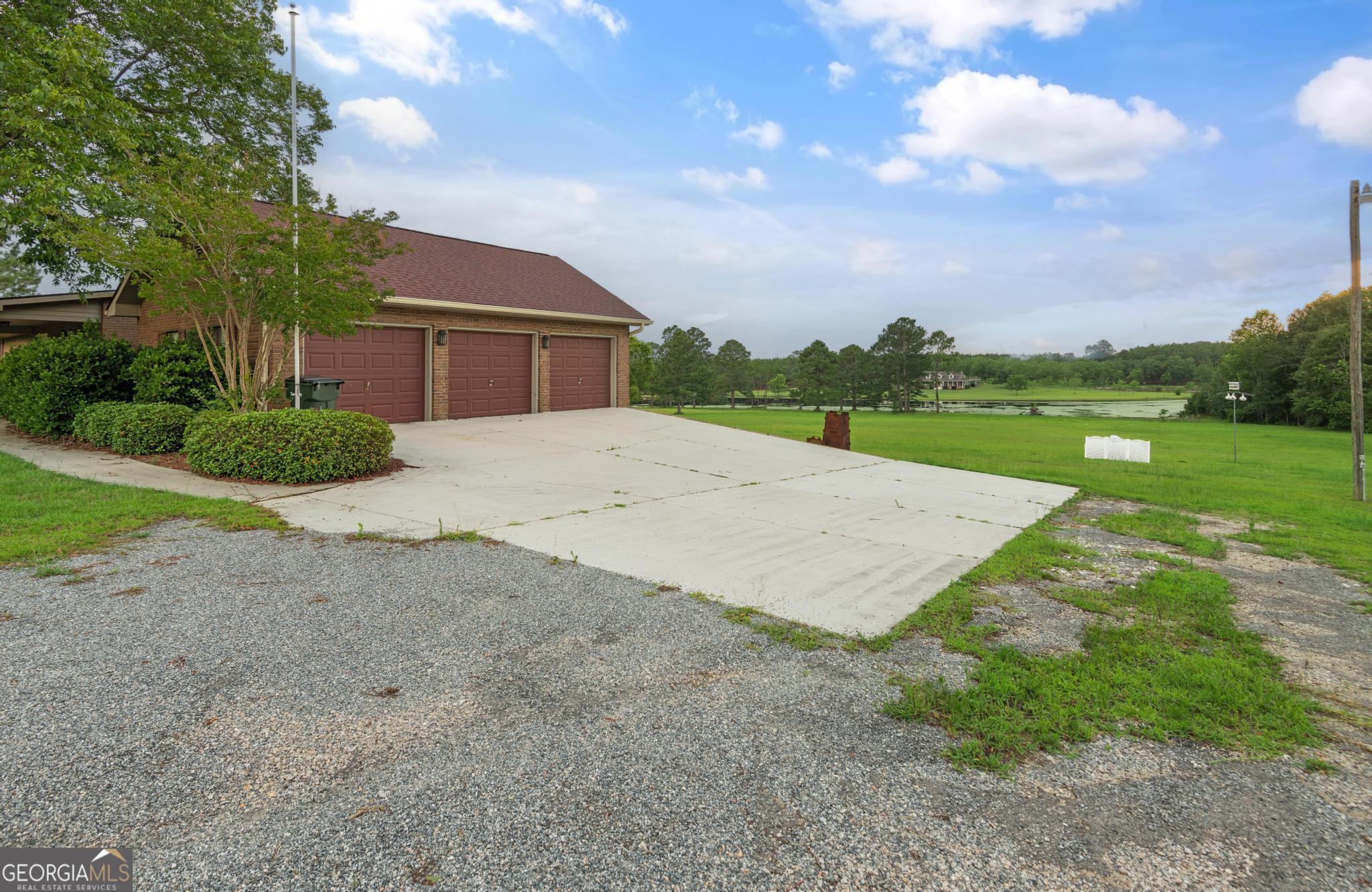 4909 Perry Road Claxton, GA 30417 - Photo 49 of 54 a view of a house with a yard