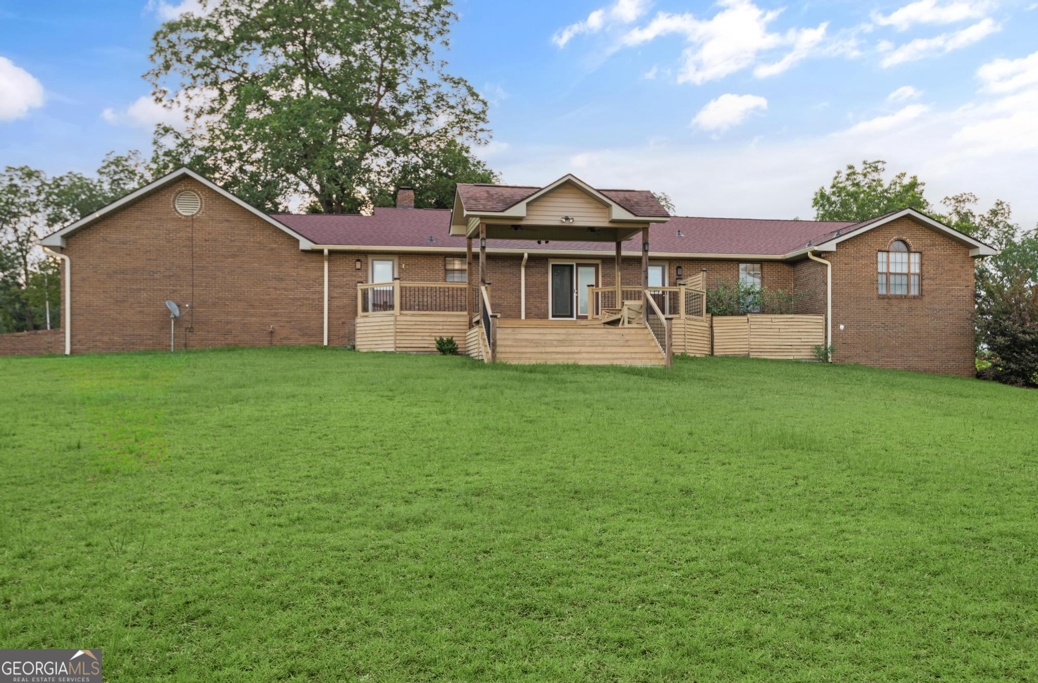 4909 Perry Road Claxton, GA 30417 - Photo 51 of 54 a view of a house with a yard and a porch
