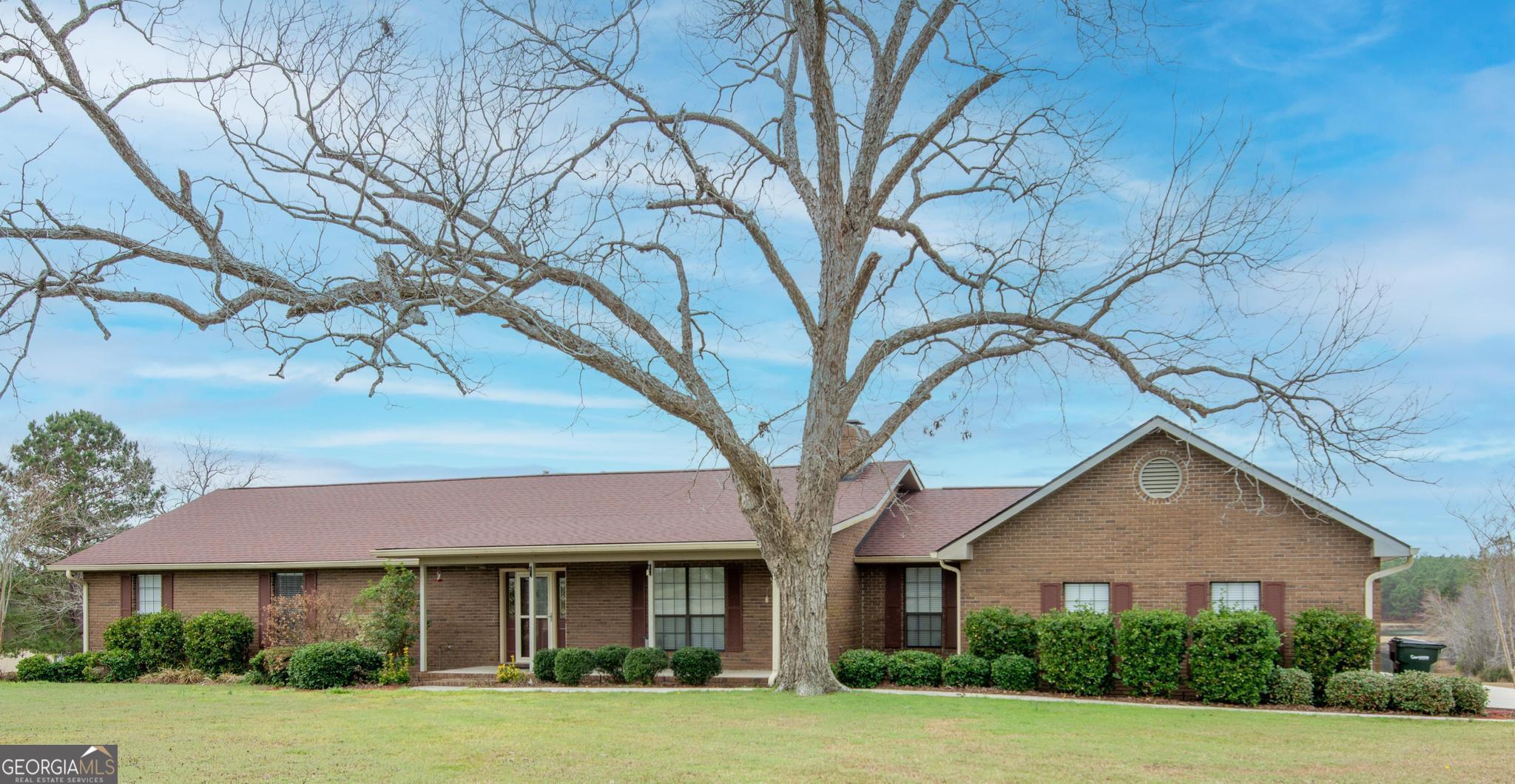 4909 Perry Road Claxton, GA 30417 - Photo 53 of 54 a front view of a house with a yard