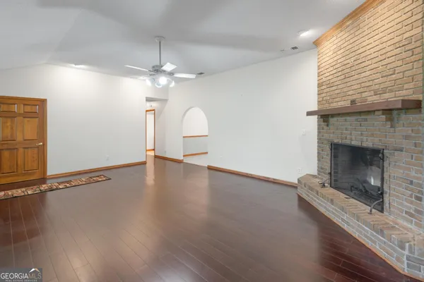a large kitchen with stainless steel appliances granite countertop a stove and a refrigerator