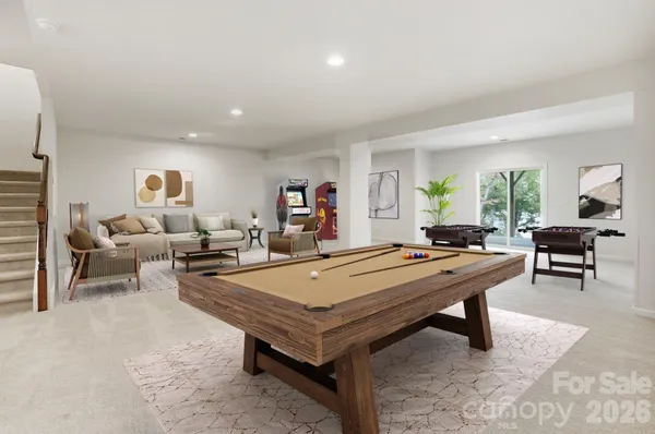 a living room with furniture pool and table