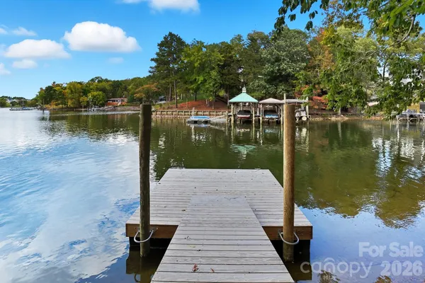 a view of a lake with houses in the back