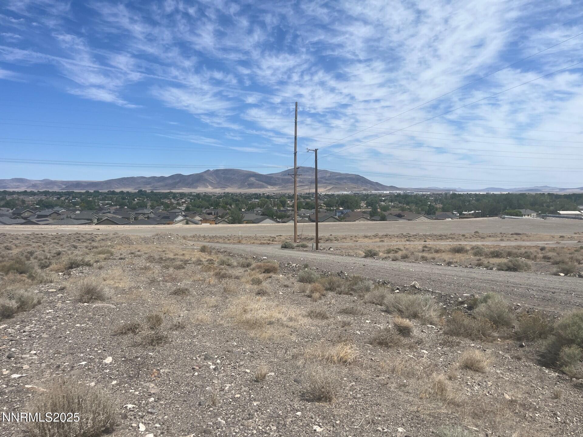21 Valley View Drive Fernley, NV 89408 - Photo 5 of 7 a view of a field with wooden fence