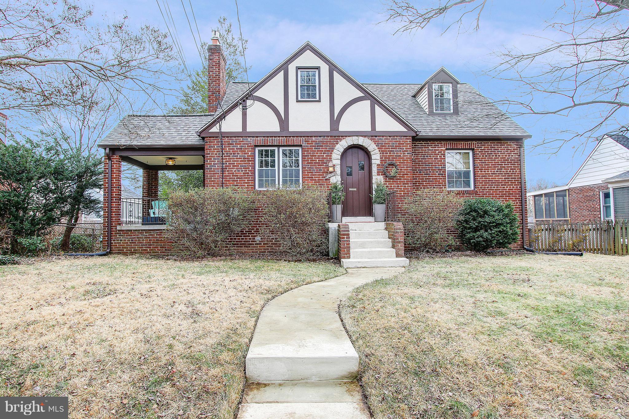 9929 Markham Street Silver Spring, MD 20901 - Photo 1 of 29 a front view of a house with a yard