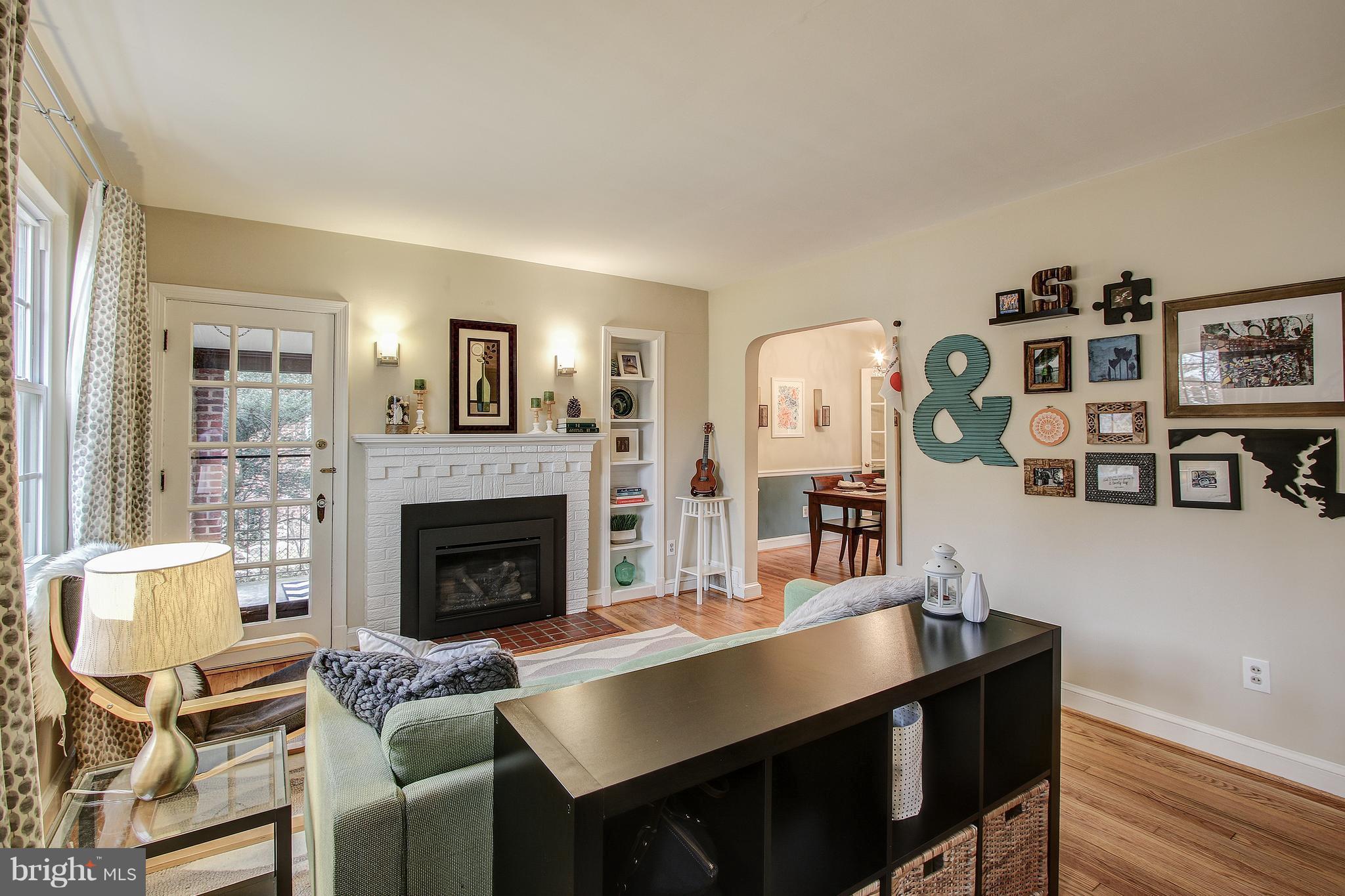 9929 Markham Street Silver Spring, MD 20901 - Photo 2 of 29 a living room with furniture and fireplace