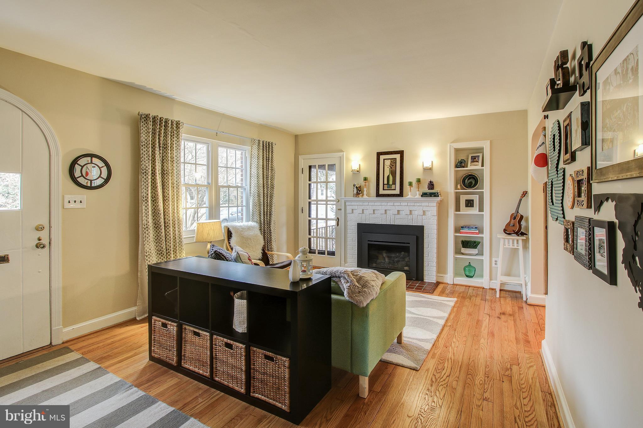 9929 Markham Street Silver Spring, MD 20901 - Photo 3 of 29 a living room with furniture and a fireplace