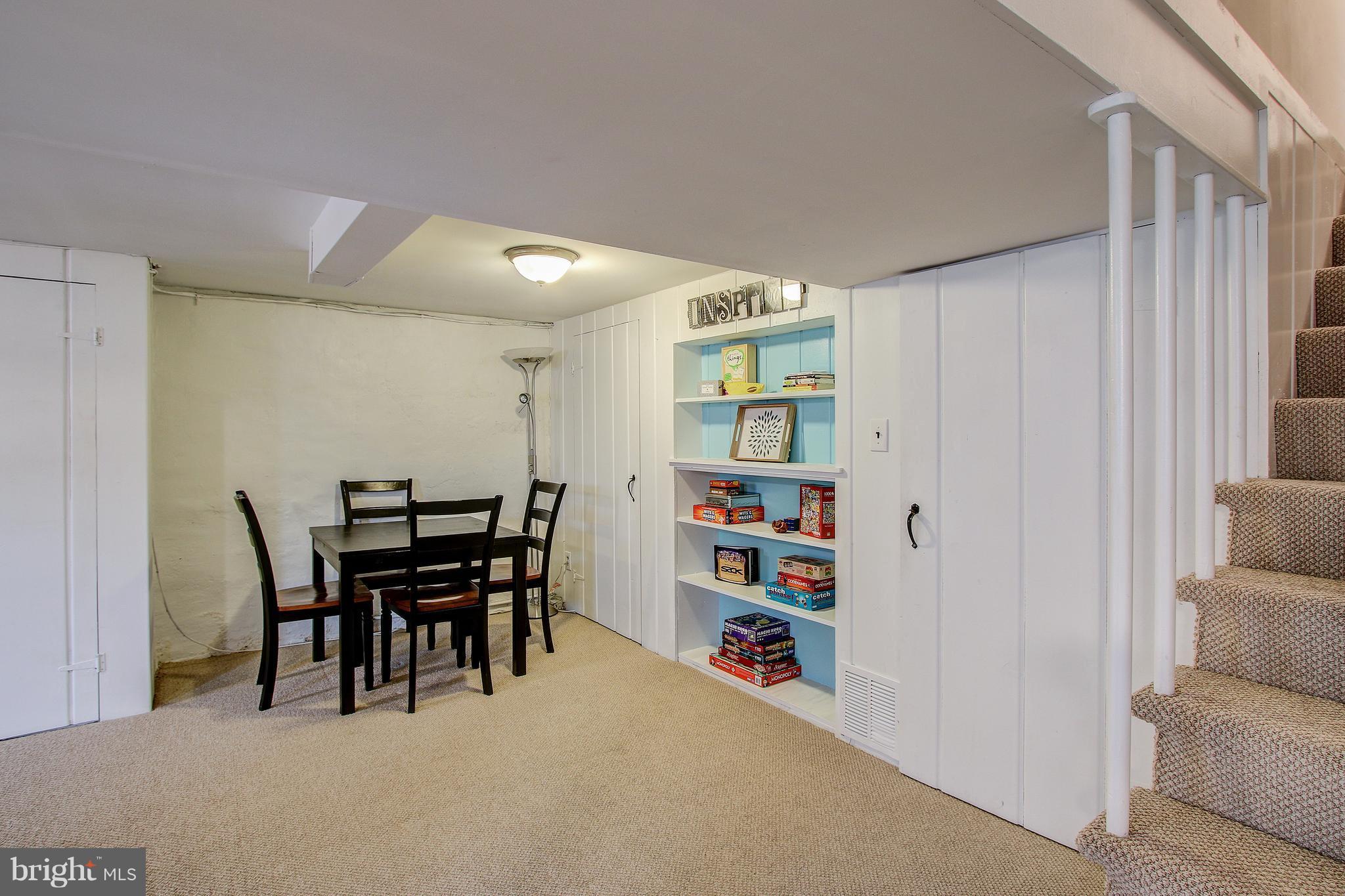 9929 Markham Street Silver Spring, MD 20901 - Photo 22 of 29 a view of a livingroom with furniture and staircase