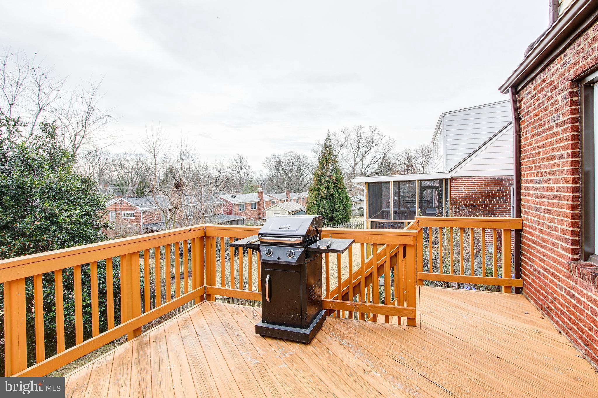 9929 Markham Street Silver Spring, MD 20901 - Photo 26 of 29 a view of a two chairs with wooden deck