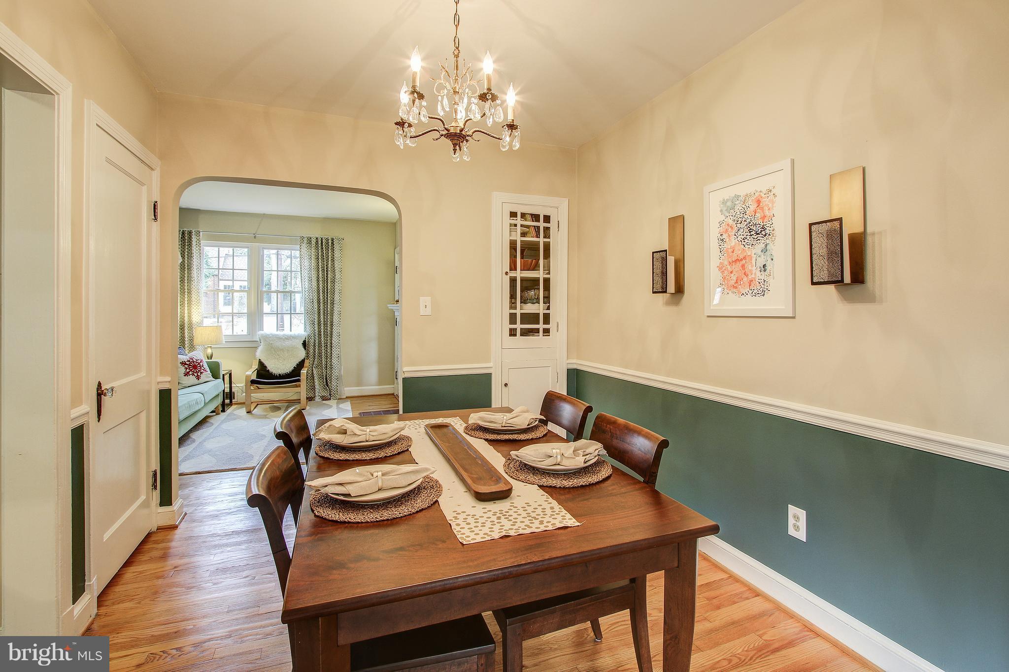 9929 Markham Street Silver Spring, MD 20901 - Photo 5 of 29 a view of a dining room with furniture wooden floor and chandelier