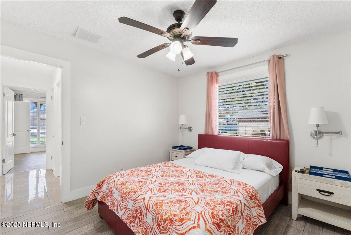 3943 Eunice Road Jacksonville, FL 32250 - Photo 20 of 49 a bedroom with a bed and a window