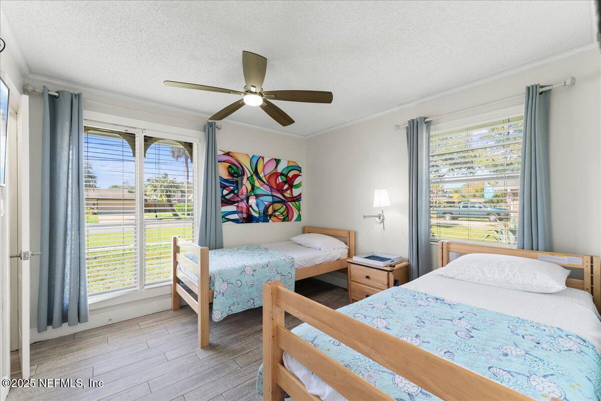 3943 Eunice Road Jacksonville, FL 32250 - Photo 21 of 49 a bedroom with a bed and a window