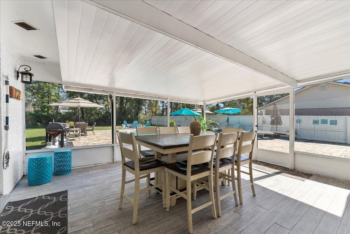 3943 Eunice Road Jacksonville, FL 32250 - Photo 29 of 49 a dining room with furniture and window