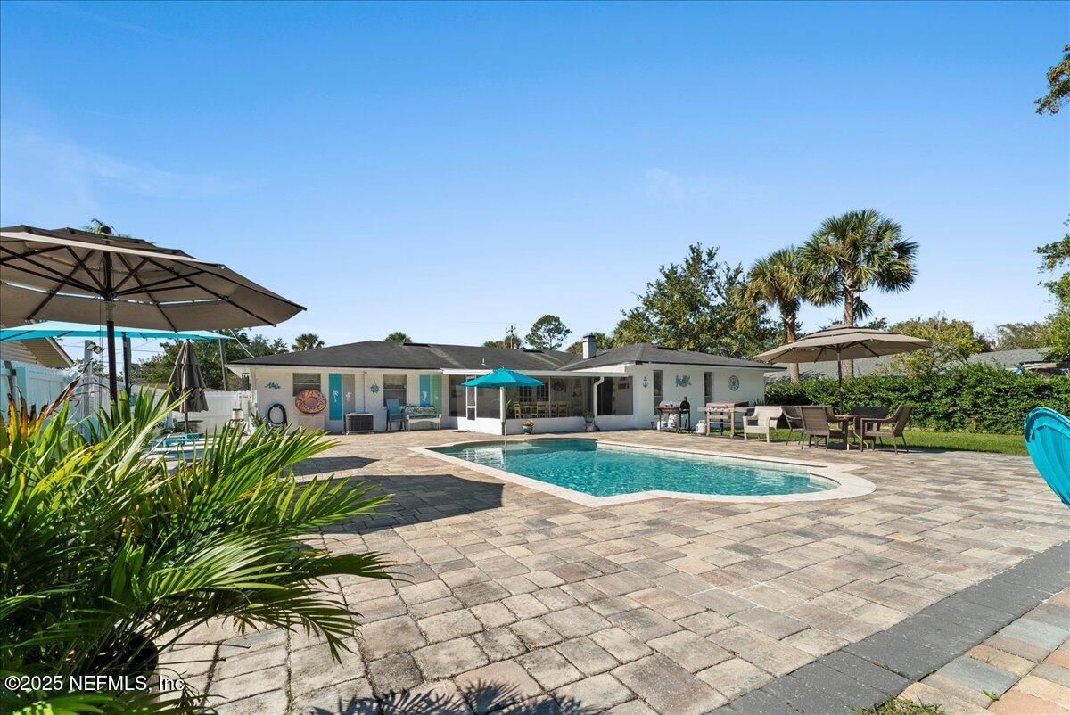 3943 Eunice Road Jacksonville, FL 32250 - Photo 36 of 49 a view of a house with backyard and sitting area