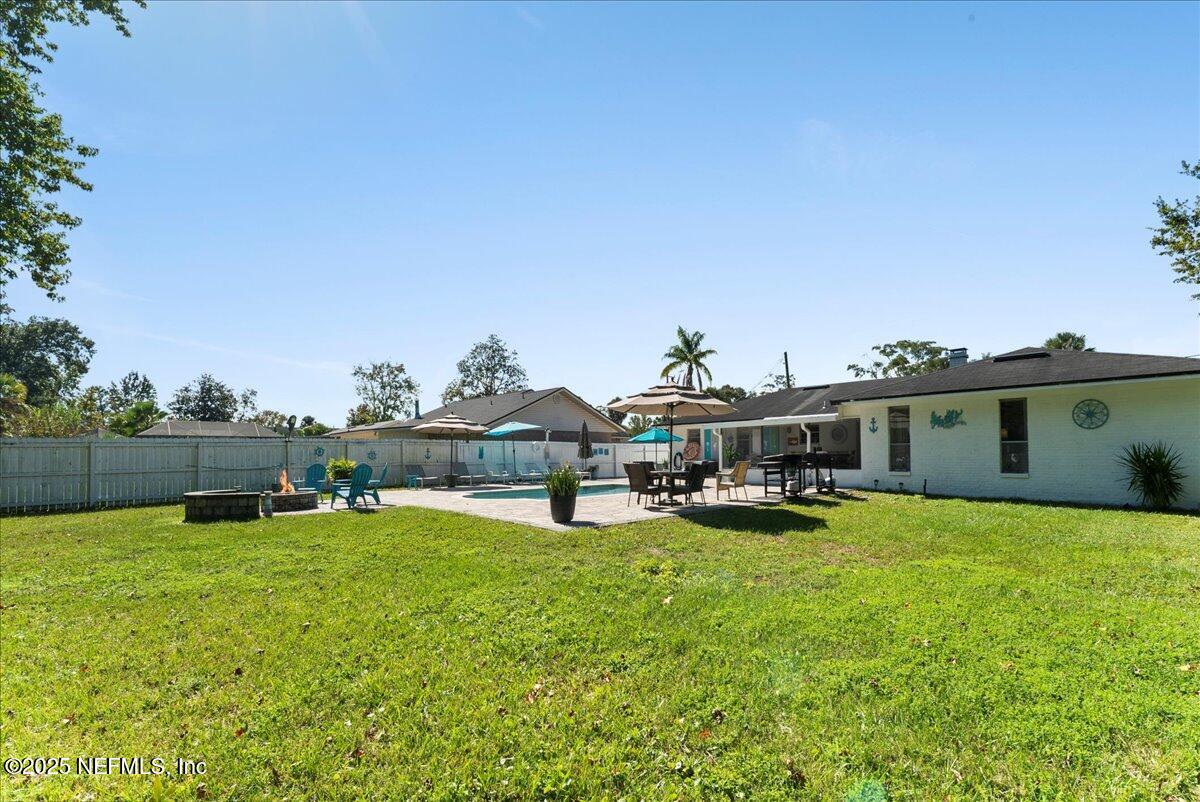3943 Eunice Road Jacksonville, FL 32250 - Photo 39 of 49 a view of a house with a yard and sitting area