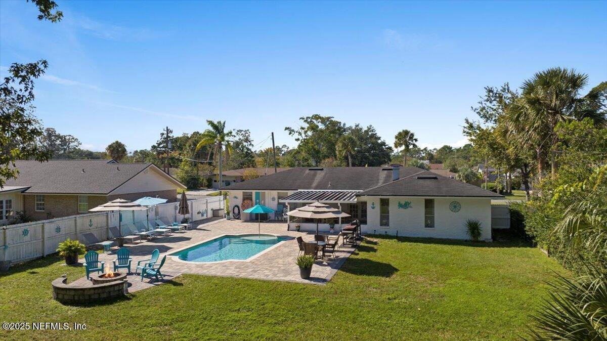 3943 Eunice Road Jacksonville, FL 32250 - Photo 40 of 49 a view of a house with backyard water fountain and sitting area