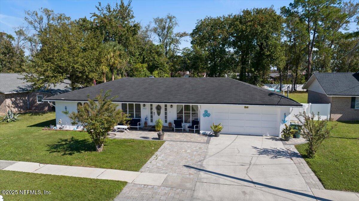 3943 Eunice Road Jacksonville, FL 32250 - Photo 42 of 49 a front view of a house with a yard