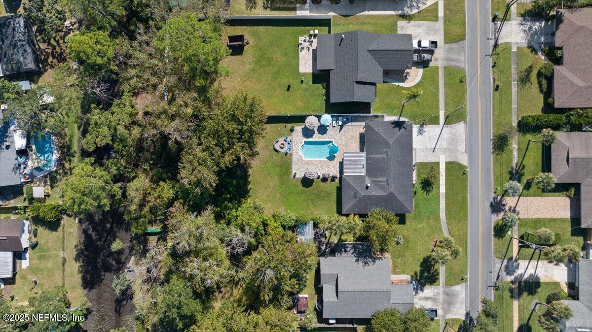 3943 Eunice Road Jacksonville, FL 32250 - Photo 43 of 49 an aerial view of a house with a yard