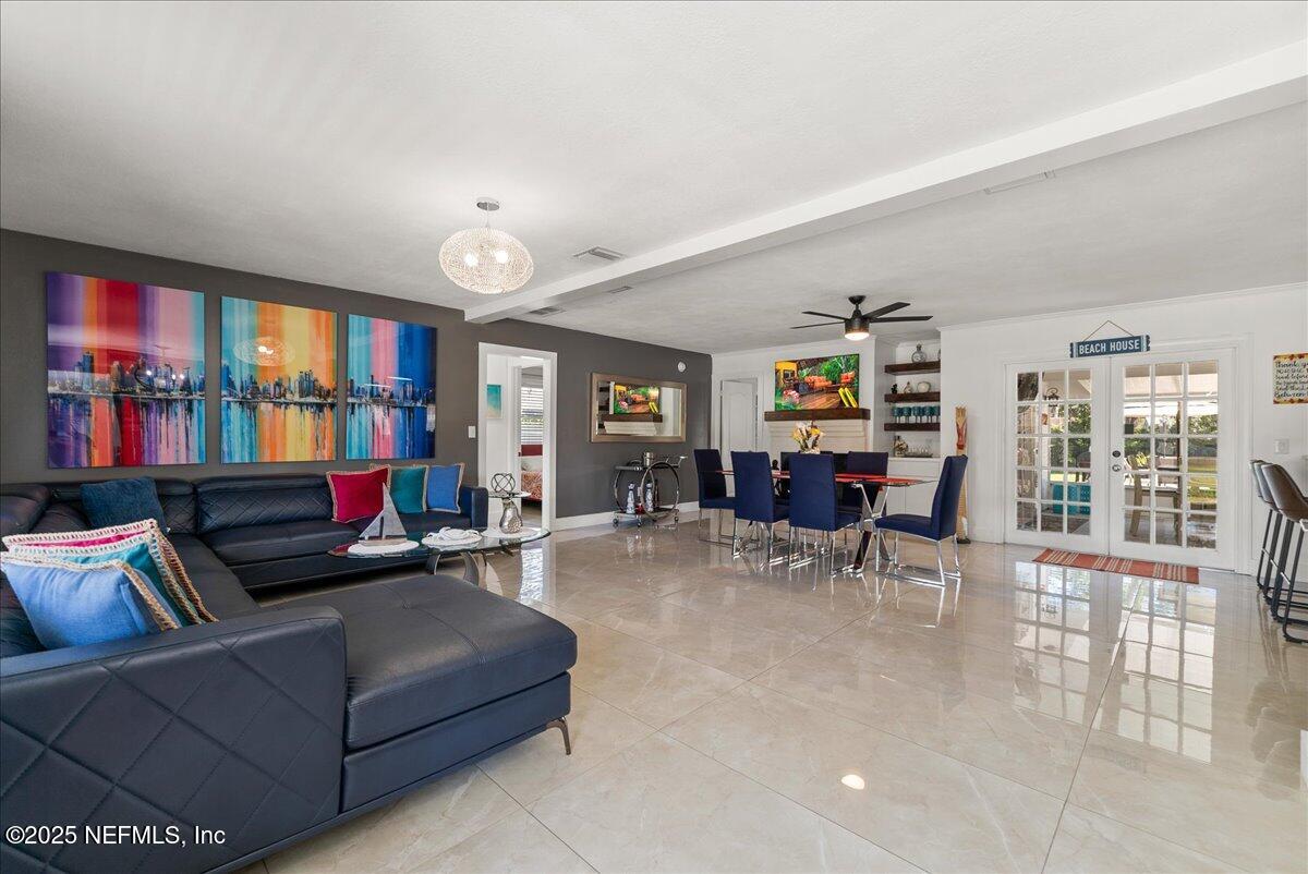 3943 Eunice Road Jacksonville, FL 32250 - Photo 5 of 49 a living room with furniture and a large window