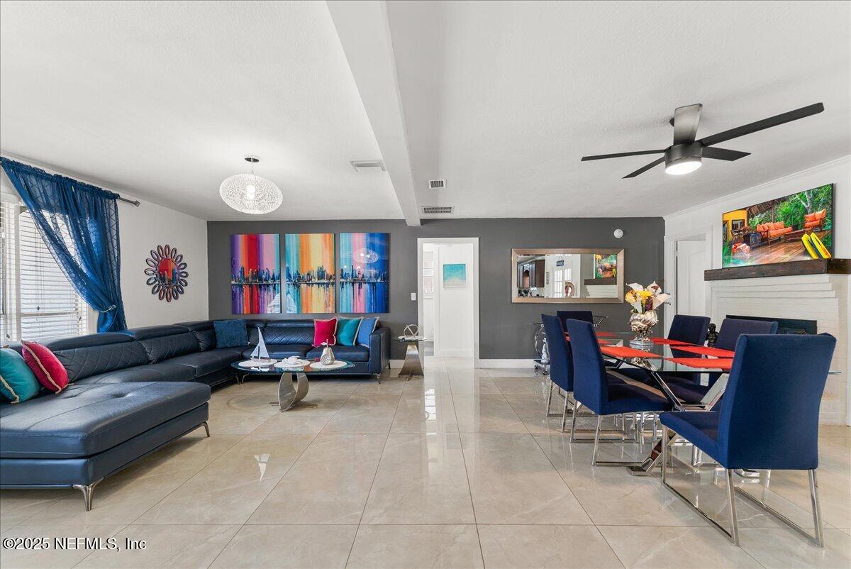 3943 Eunice Road Jacksonville, FL 32250 - Photo 8 of 49 a living room with furniture and a flat screen tv