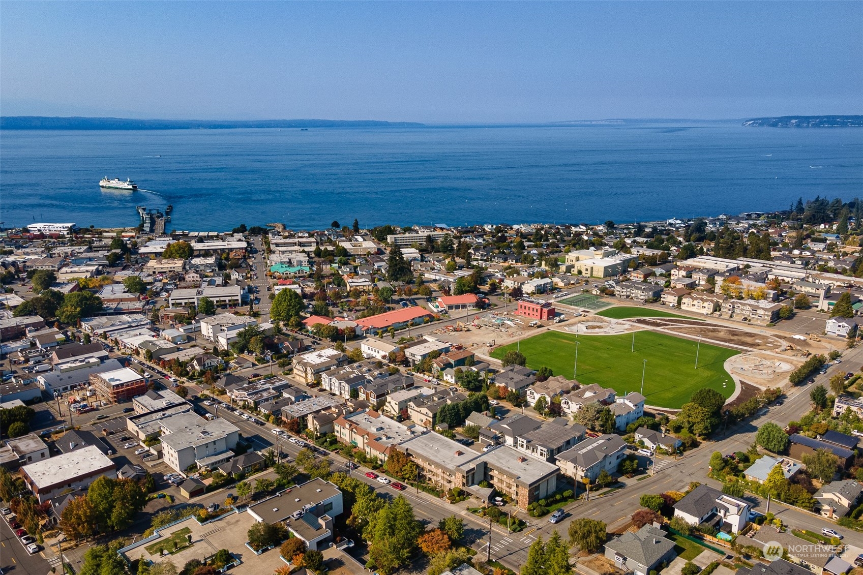 655 Main Street, Unit 301 Edmonds, WA 98020 - Photo 1 of 28 an aerial view of a building and ocean view