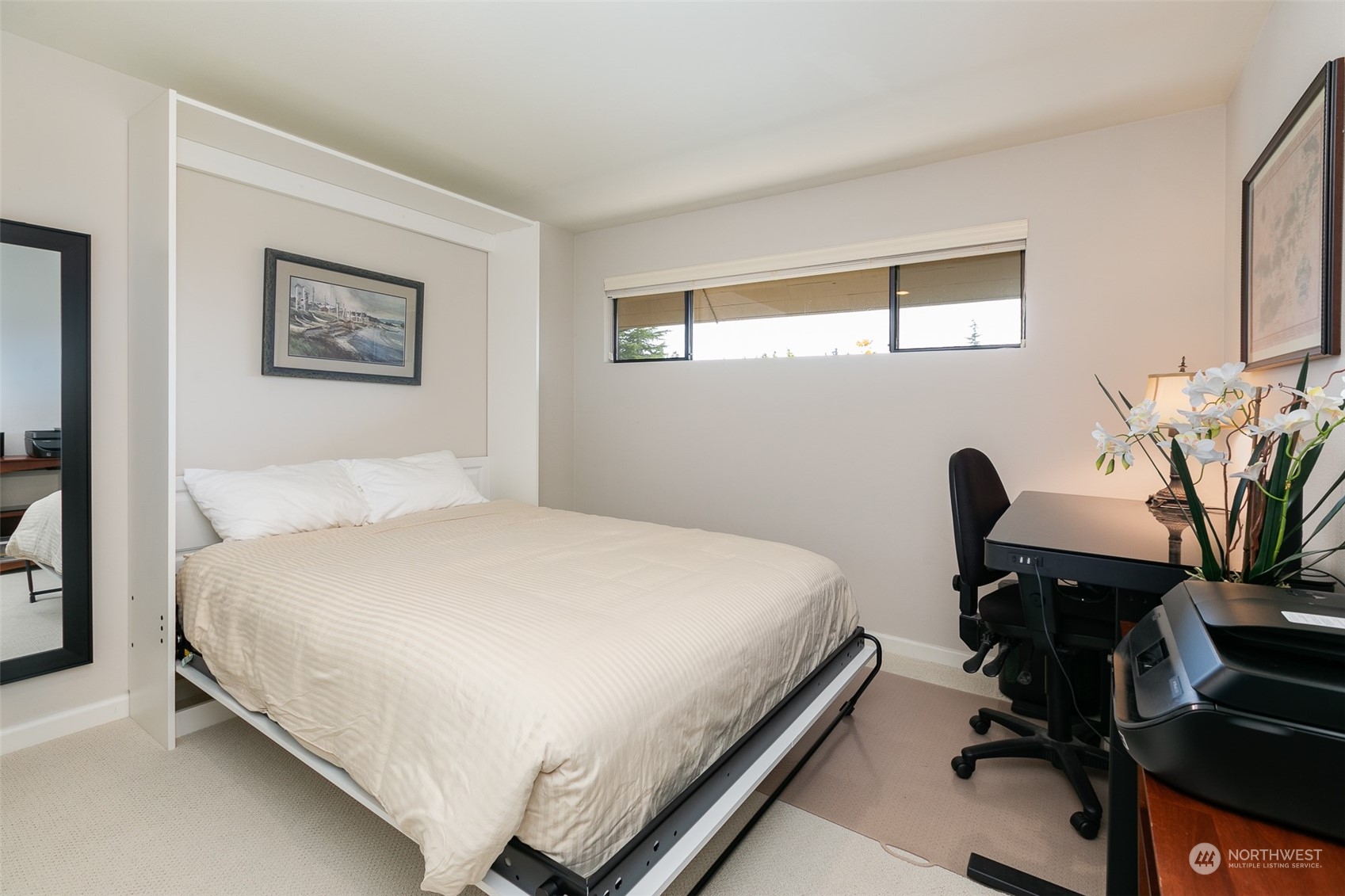 655 Main Street, Unit 301 Edmonds, WA 98020 - Photo 19 of 28 a bedroom with a bed and a desk