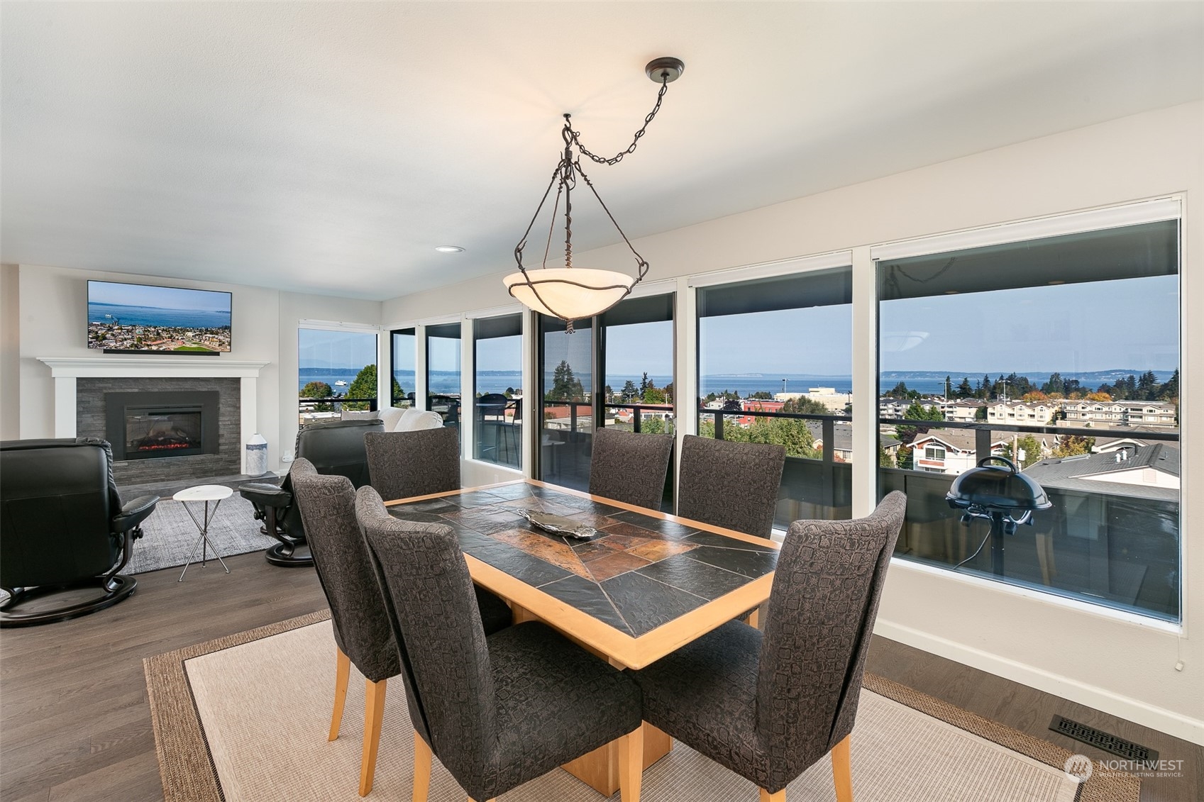 655 Main Street, Unit 301 Edmonds, WA 98020 - Photo 4 of 28 a living room with lots of furniture and a chandelier