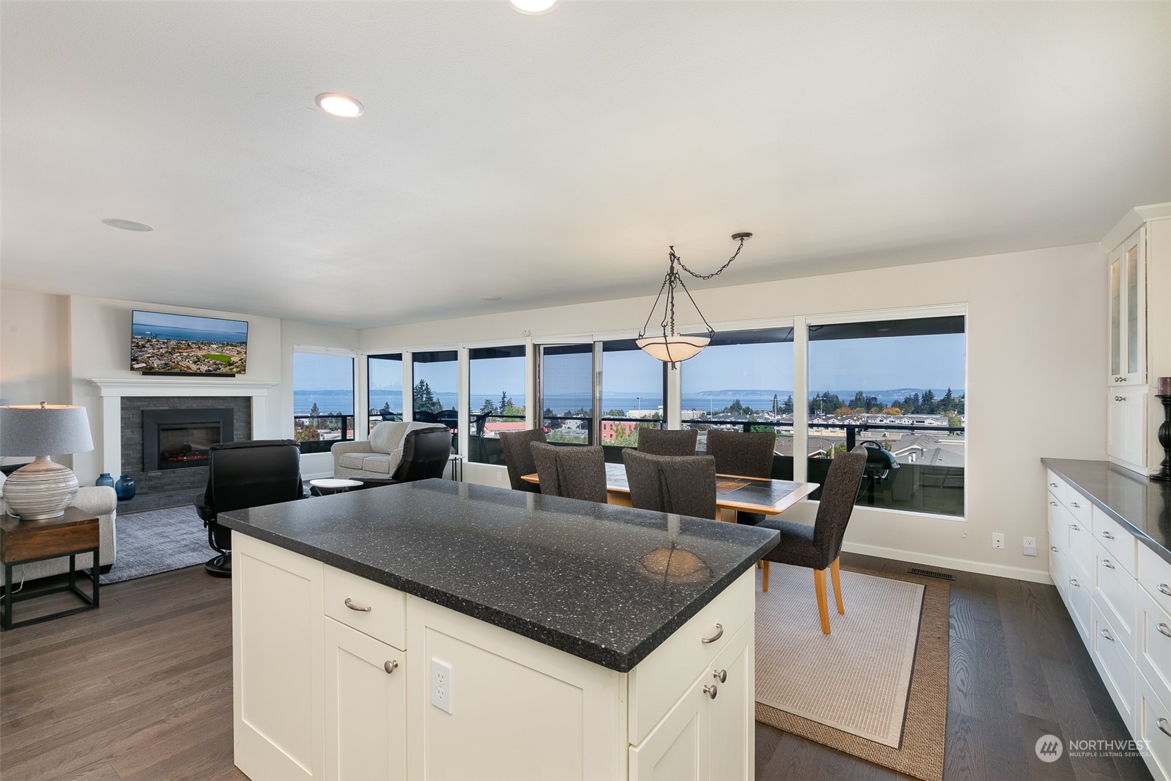 655 Main Street, Unit 301 Edmonds, WA 98020 - Photo 5 of 28 a living room with stainless steel appliances granite countertop furniture and a kitchen view