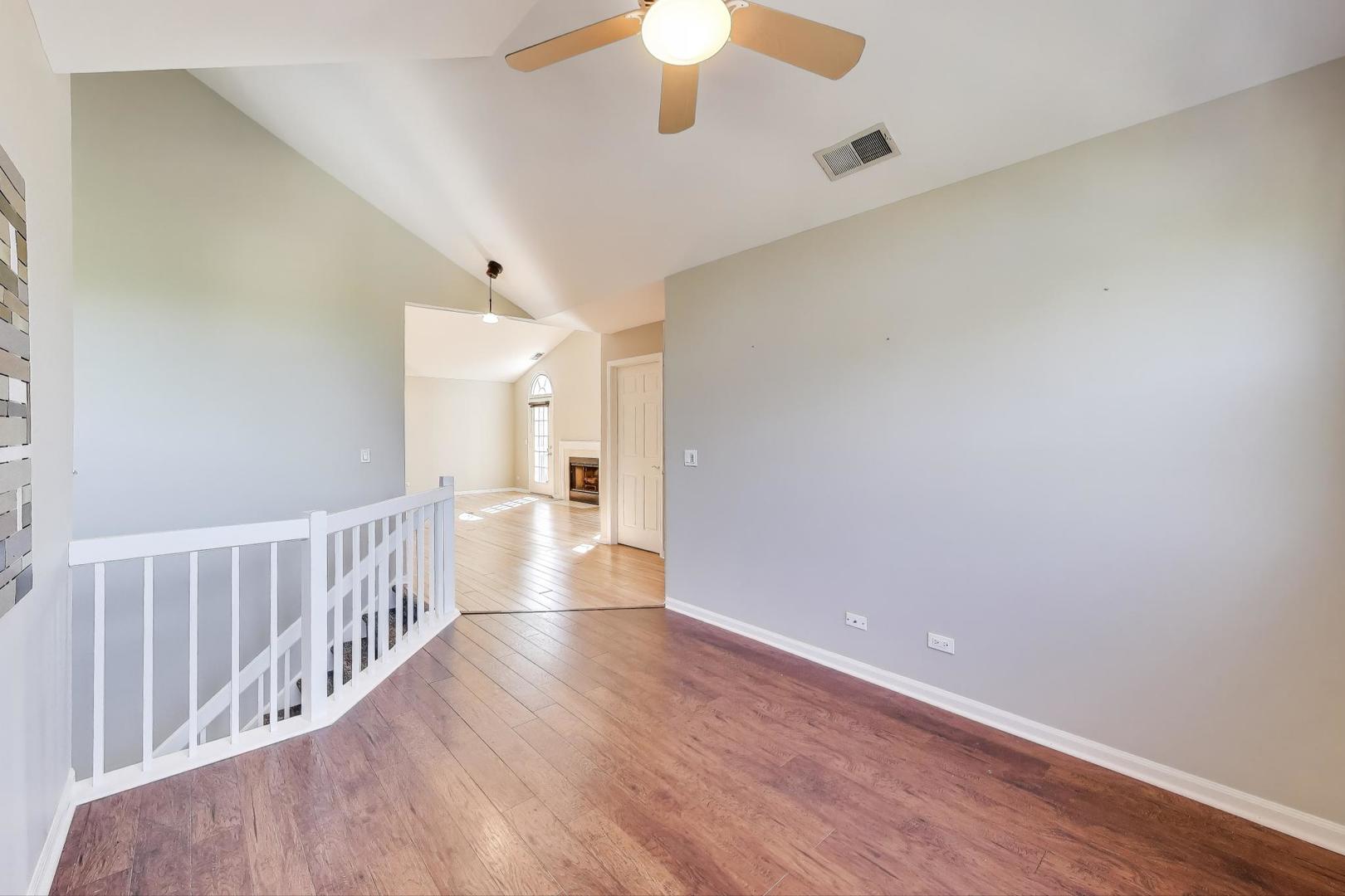 914 Prospect Court, Unit 914 Naperville, IL 60540 - Photo 11 of 38 a view of a hallway with wooden floor