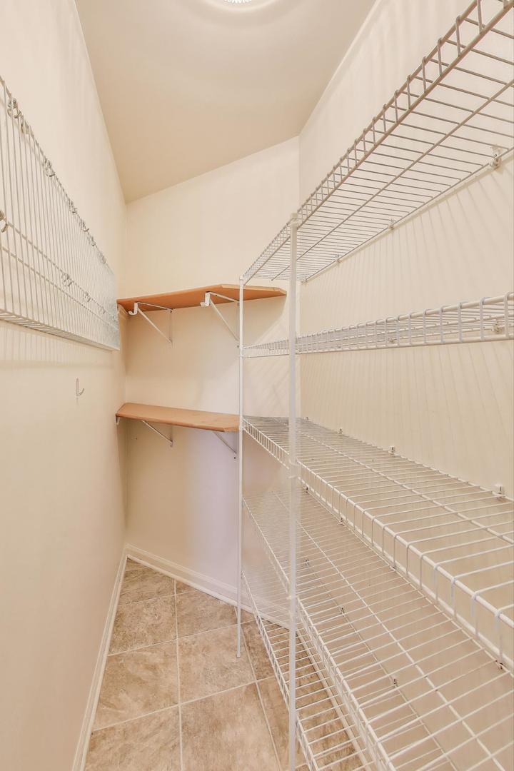 914 Prospect Court, Unit 914 Naperville, IL 60540 - Photo 15 of 38 a view of a room with racks on the wall